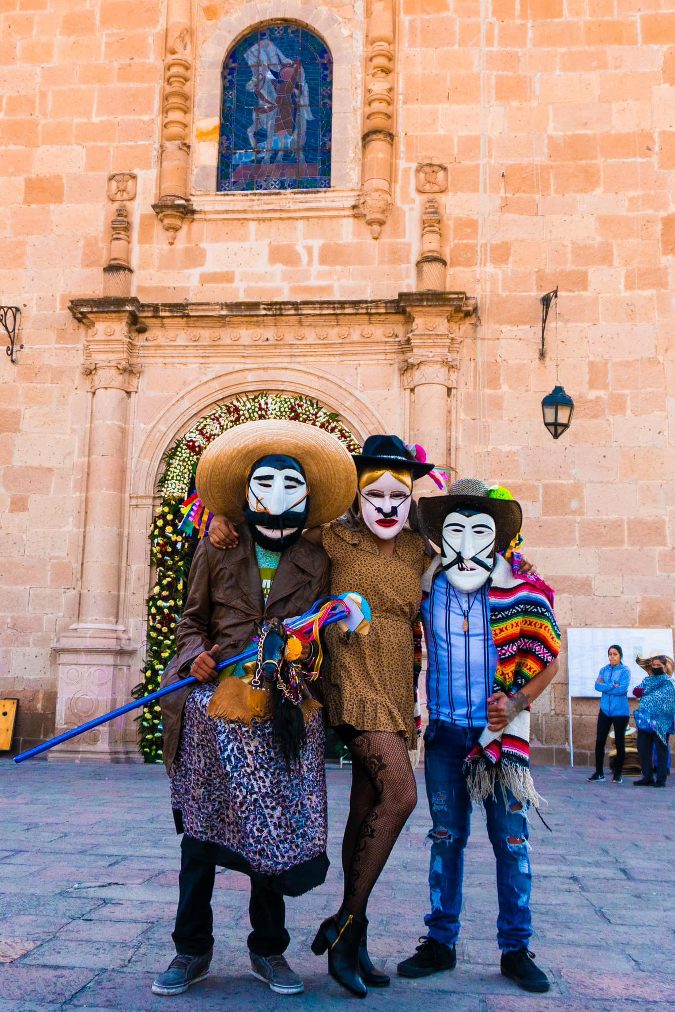 El Jinete with his caballito (left), La Maringuía (center), and El Caporal (right). All characters are played by men from the community.2