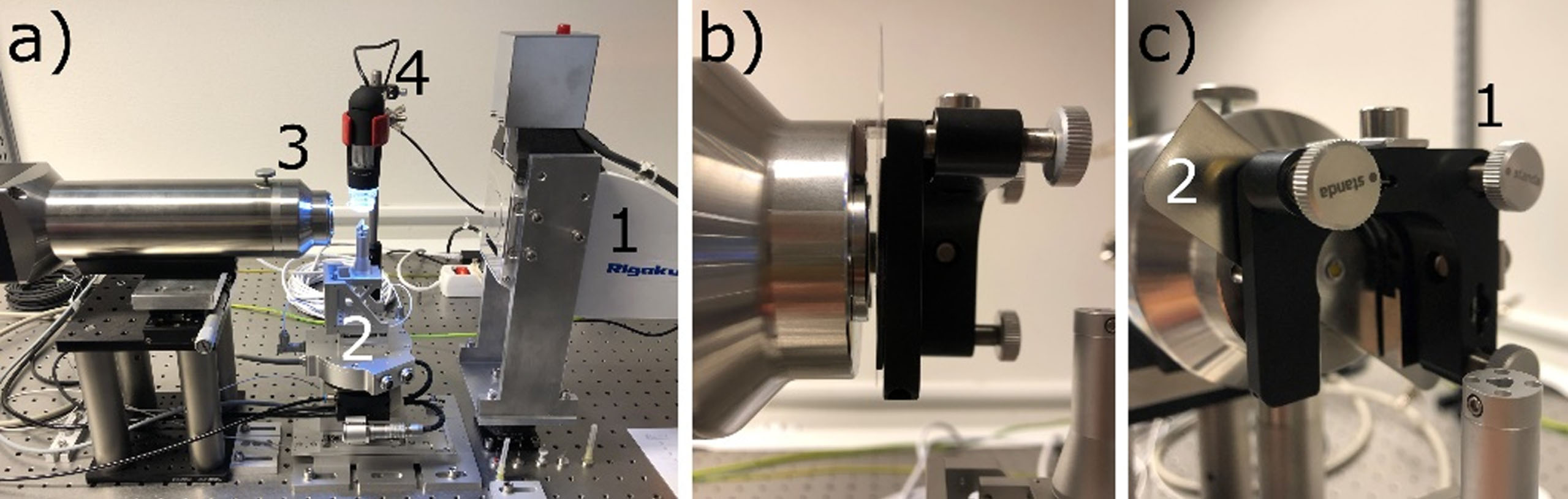 a) Photo of the tomography setup. From right to left: 1 - source, 2 - sample stage, 3 - high-resolution scintillator detector, 4 - top view USB microscope for monitoring. b) and c) photo of the scintillator mount attached to the objective lens without build-in scintillator: 1 - micrometer screws of kinematic mount, 2 – magnetically attachable scintillator carrier plate with pinhole. Note that the picture in a) shows the detector with a commercial scintillator.